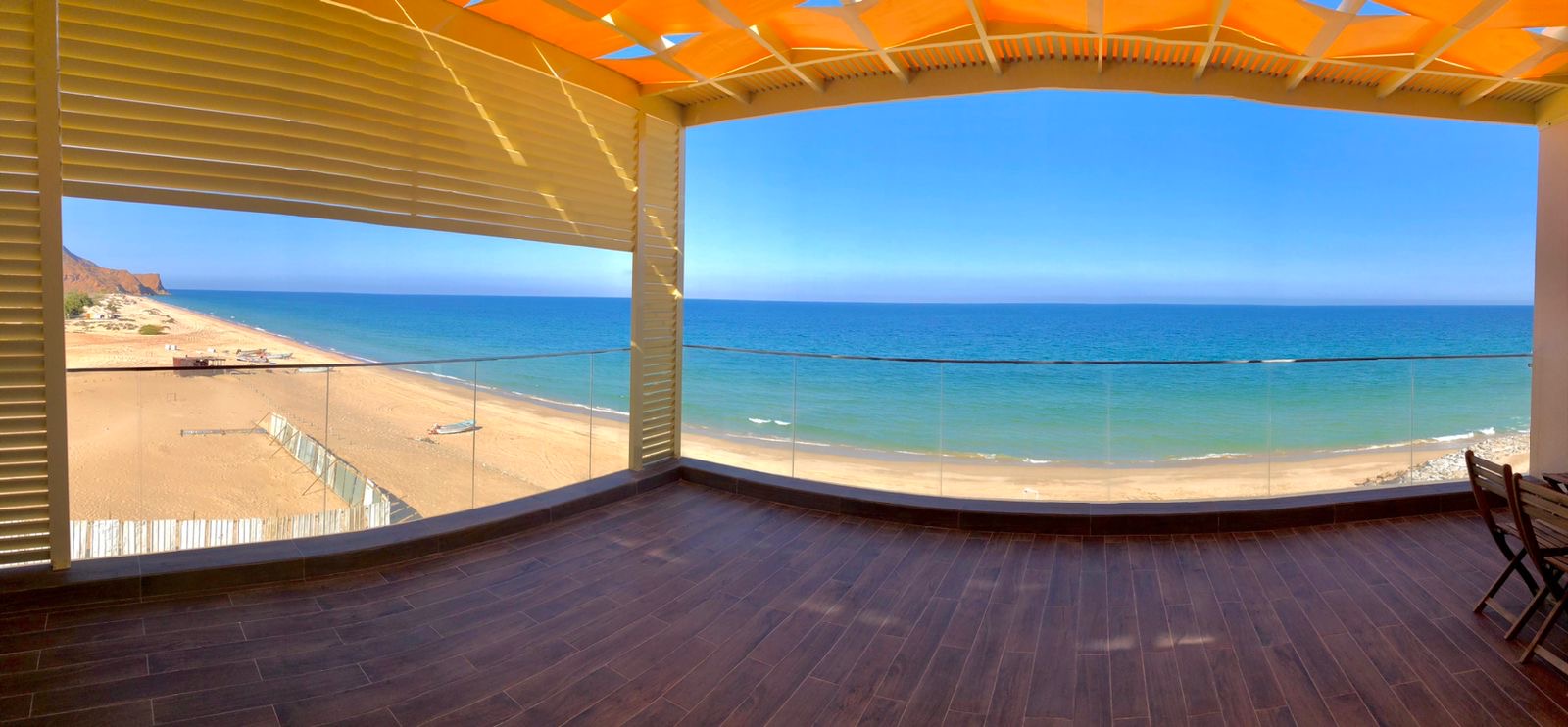 Sea-facing terrace overlooking the white sand beach at Sifa