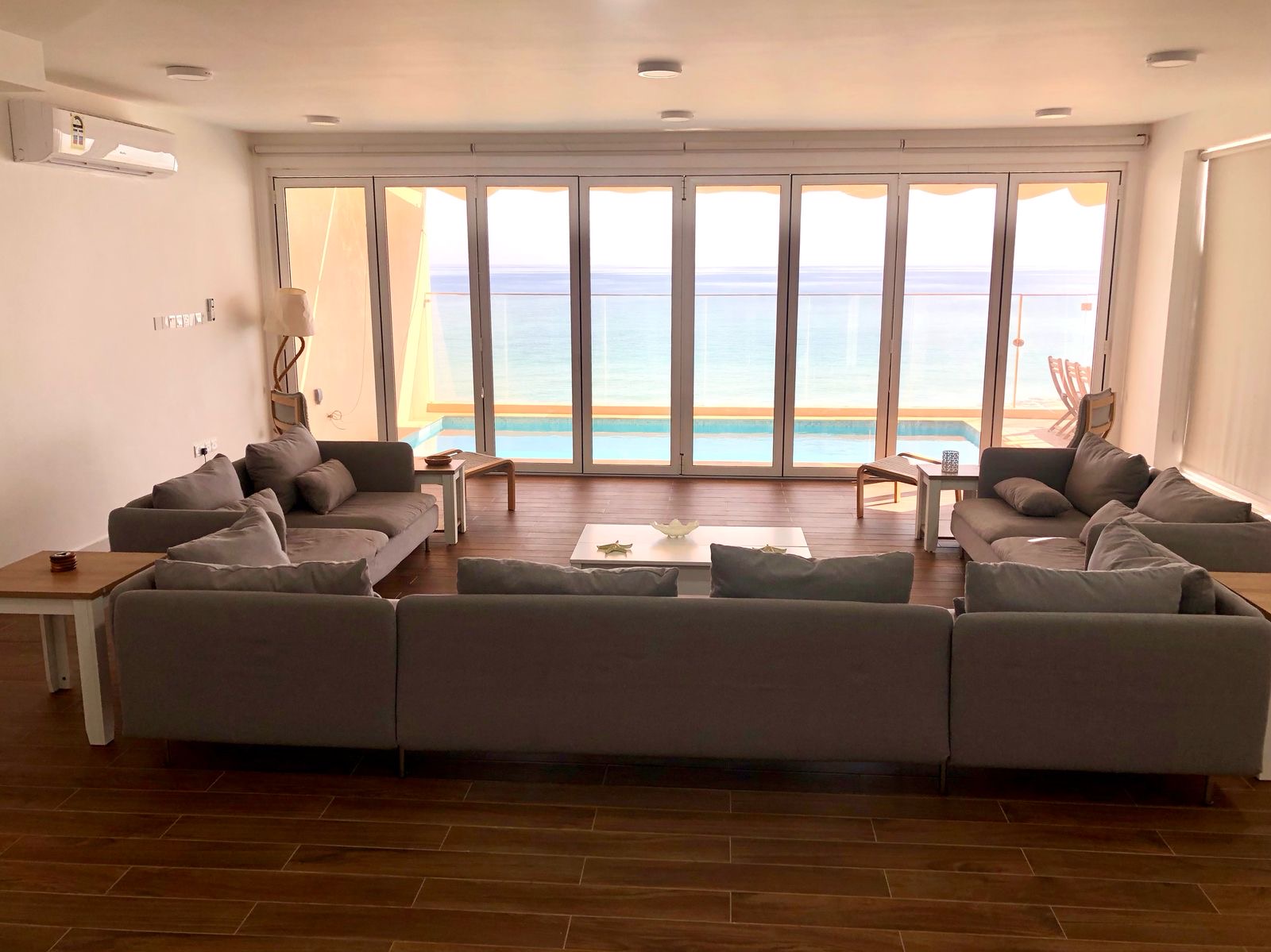 Casa del Sol open living room opening onto the private pool and sea